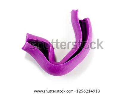 Plasticine purple for children's creativity on a white background.