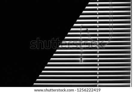 Blinds and a black shade on a window