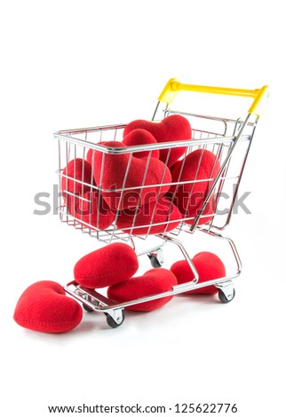 Many red hearts in shopping cart and fall on the floor