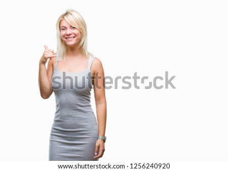 Young beautiful blonde woman over isolated background smiling doing phone gesture with hand and fingers like talking on the telephone. Communicating concepts.