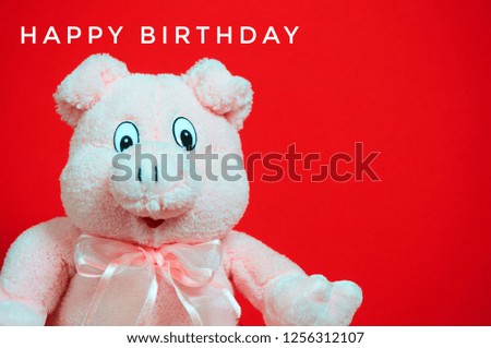 Happy birthday with pink pig on red background