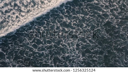 Aerial view beautiful of sea waves from drone. Stock image picture of blue color ocean water, wave, sea surface. Top view on turquoise waves, clear water surface texture. Top view, amazing nature 