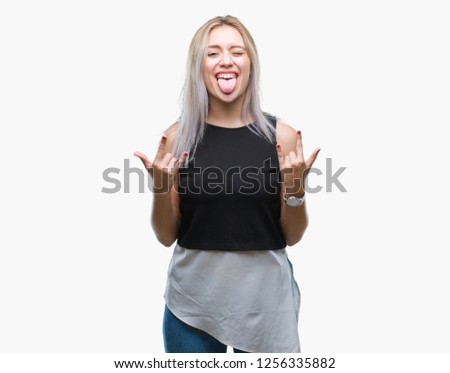 Young blonde woman over isolated background shouting with crazy expression doing rock symbol with hands up. Music star. Heavy concept.