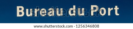 Port Office Sign (written in French language), Port Harbourmaster's entrance, cream white lettering on blue background,