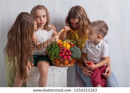 children with healthy eating fresh vegetables tomatoes broccoli with lemon pepper, radish