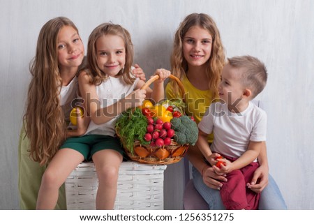 children with healthy eating fresh vegetables tomatoes broccoli with lemon pepper, radish