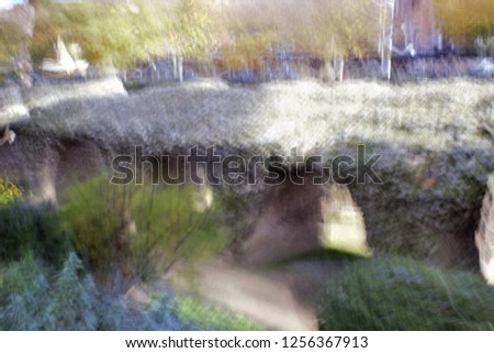 Roman ruins, gardens in Autumn, Tribute to Monet, impressionist photograph of the Park of the Roman circus, Toledo, Spain,  photographic sweeps at low shutter speed, feeling of movement, of life,