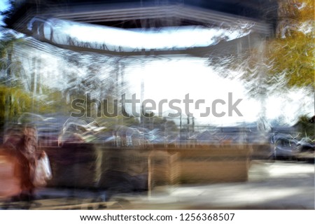 bandstand, Tuesday Market, flea market, Tribute to Monet, impressionist photograph of the Vega Park in Toledo, Spain,  photographic sweeps at low shutter speed, feeling of movement, of life,