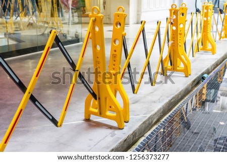 Yellow Portable Plastic Folding Safety Barrier, traffic fence, yellow fence, Suitable to Restrict Access in Building, Road or Dangerous Area with exclamation marks, concept of prohibition