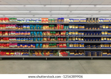Pasta Packaging on a shelf in a supermarket. is suitable for presenting new packaging among many others. Royalty-Free Stock Photo #1256389906