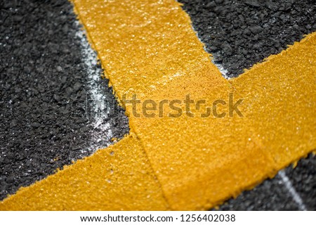 Close up fresh Thermoplastic on the asphalt road Royalty-Free Stock Photo #1256402038