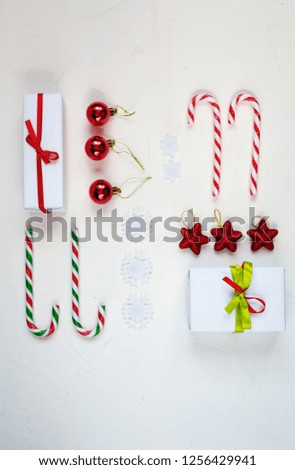 Christmas flat lay of toys and gifts on white background. Holiday concept, top view.