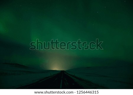 The road to the North. Driving with beautiful sky performance. Aurora borealis