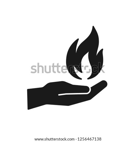 Black isolated icon of flame in hand on white background. Silhouette of fire and hand. Flat design.