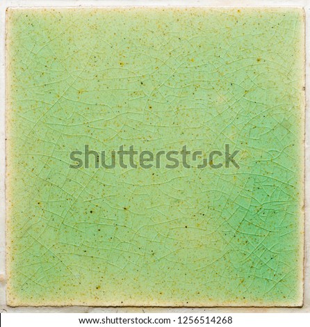close up background and texture of stretch marks cracked on emerald green glazed tile