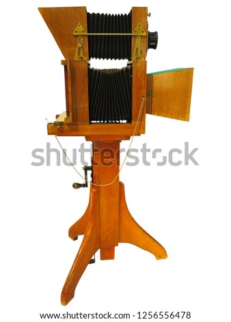 Vintage antique wooden old photo camera isolated over white background