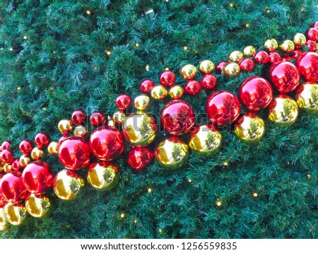 Christmas abstract background with shiny ball decorations and green tree 