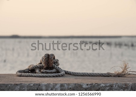 the anchor with rope on the beach