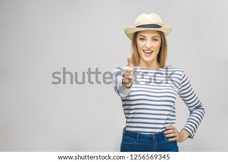 Young happy cheerful woman showing thumb up isolated over white background - 