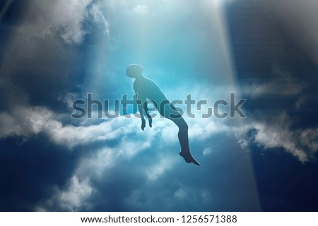 Soul of deceased man taken up into heaven. Afterlife, meditation and dream concept Royalty-Free Stock Photo #1256571388