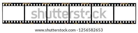 long film strip, 6 blank photo frames, free space for your pictures, real high-res 35mm film strip scan with signs of usage on white background, no or empty movie strip, interesting border Royalty-Free Stock Photo #1256582653