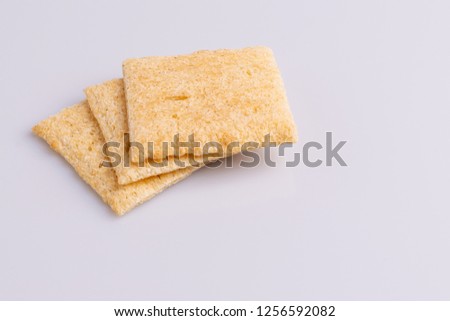 Pile stack of diet rice crackers isolated on white background, soft light, angle view, copy space