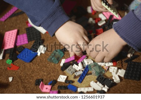   the children plays in a designer home                              