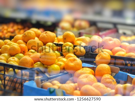 Fresh fruits, tangerines and oranges are sold in the market.