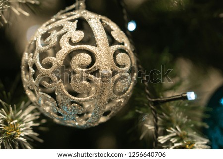 Spruce branches, fir cones and Christmas decorations. Christmas still life. Christmas decorations on music sheets, closeup.