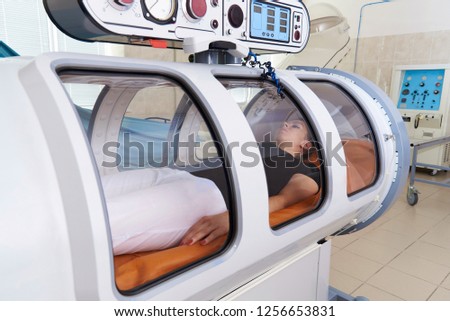 Hyperbaric oxygen chamber in a hospital. Royalty-Free Stock Photo #1256653831