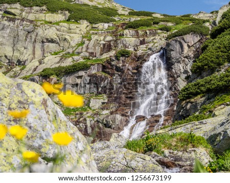 The view of Skok waterfall in the western part of High Tatras. High Tatras mountains, Slovakia Royalty-Free Stock Photo #1256673199