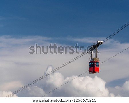 The cable car with clouds in the background captured in Lomnicky stit. High Tatras mountains, Slovakia Royalty-Free Stock Photo #1256673211