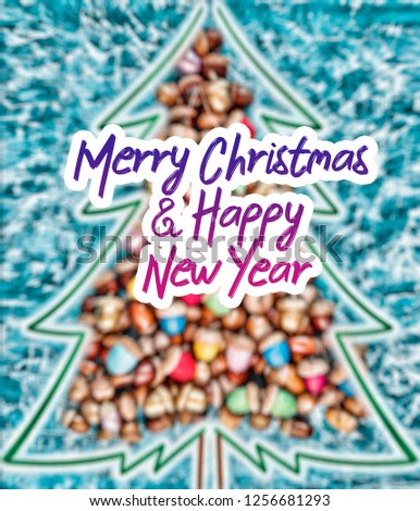 merry christmas and happy new year CARD background handmade handicraft garland of colored acorns, decorative toys and a wooden christmas-tree - Image