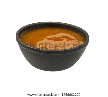Orange sweet and sour sauce isolated on white background.Chicken sauce