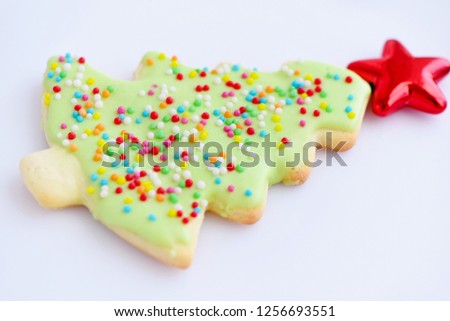 Gingerbread in the form of a christmas tree on a white background. Close-up