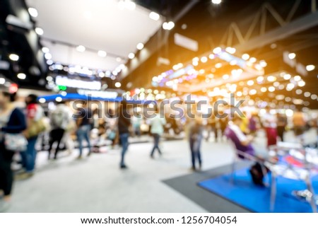 Abstract blurred defocused tradeshow event exhibition, business convention show, job fair, technology expo. Organization company trade fair event. Marketing advertisement concept. Royalty-Free Stock Photo #1256704054