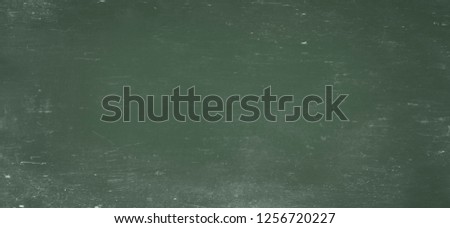 background of old blank green scratched school blackboard 