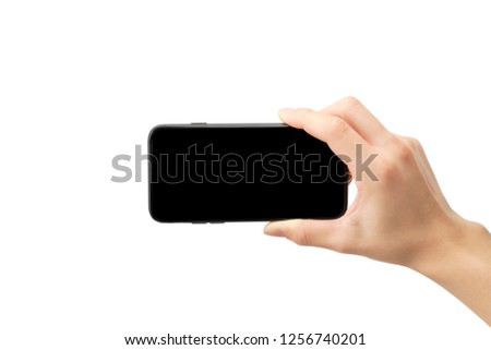 Hand holding a smartphone for take a picture, touch screen is black and have clipping path.