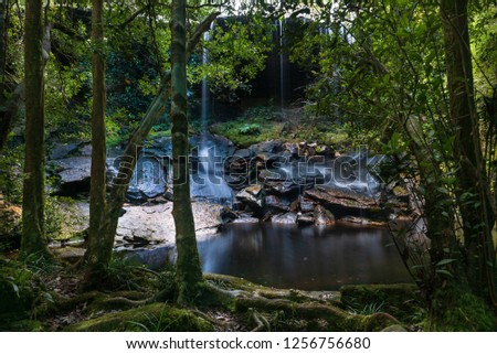 Waterfall falling on the rock in the jungle at Phu Kradueng, Thailand.Long exposure photography.