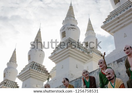 White pagodas and colored arhats