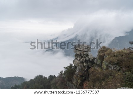 waterfall clouds spilling over the leeward slope of lushan mountain, jiangxi province, China