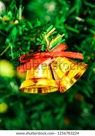 Golden bells and beautiful Christmas tree, Christmas Eve decoration,happy festival, gift and celebration holiday. 
