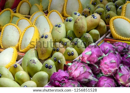 mango and pittahaya on the shelves of the Asian market