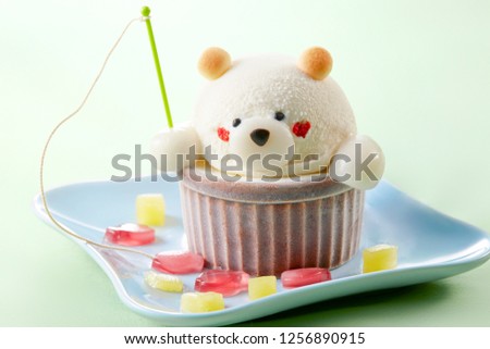 Vanilla ice cream in the shape of bear which goes fishing