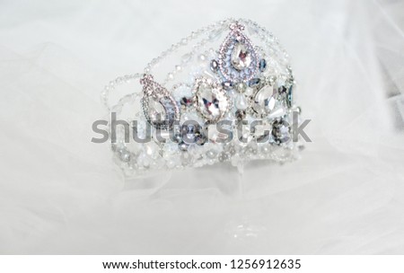 Beautiful silver crown on a grey background for the design