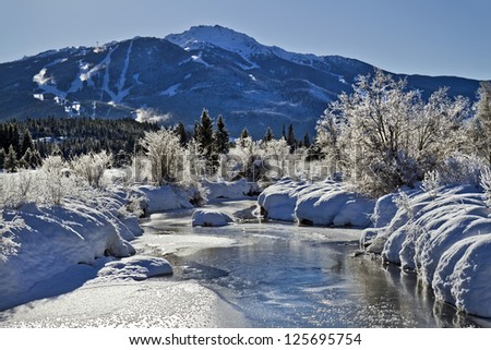 A wintry scene of the Frozen River of Golden Dreams, Whistler resort, British Columbia, Canada Royalty-Free Stock Photo #125695754