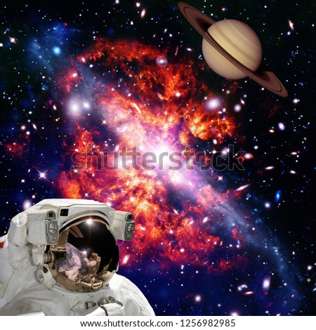 Astronaut looking at the planet against space. The elements of this image furnished by NASA.