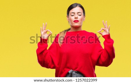 Young beautiful business woman wearing winter sweater over isolated background relax and smiling with eyes closed doing meditation gesture with fingers. Yoga concept.