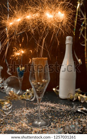 new year background with star splatter and sparkler and different new year items