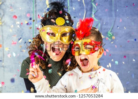 Mother and son celebrating Carnival at home